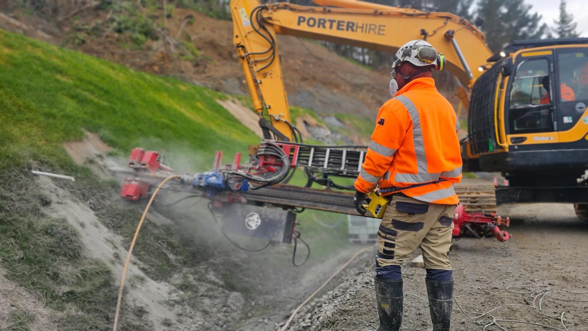 Aerial view of slope stabilisation works beside a NZ native bush highway