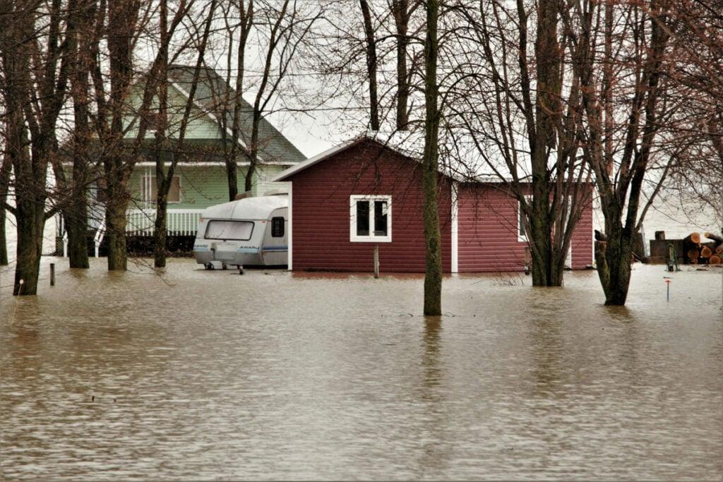 Floodwater surrounding a home after a storm event