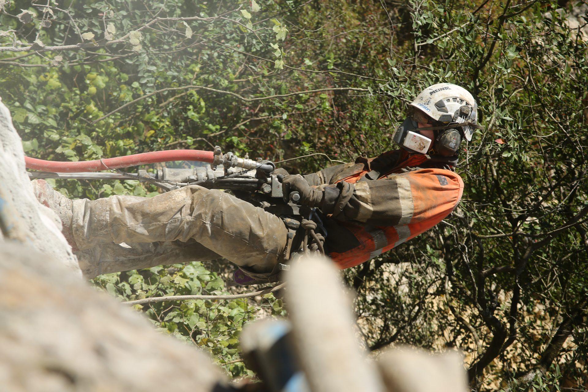 GSI crew operating drilling equipment on the Epitaph Haast Pass rockfall remediation project